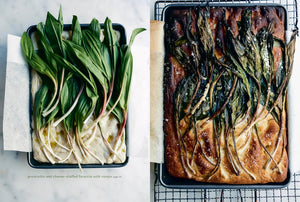 A side-by-side comparison of raw and cooked prosciutto and cheese-stuffed focaccia with ramps. The left panel shows the raw dough topped with fresh green ramps in a black baking pan. Photograph of prepared dish inside cookbook "Rooted Kitchen" by Ashley Rodriguez. 
