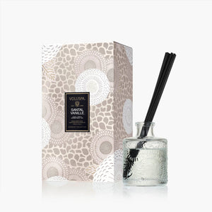 Voluspa "Santal Vanille" room diffuser box and glass vessel with reeds. 