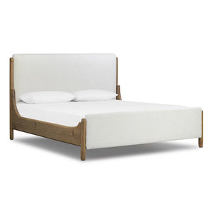 Bed with wooden frame and white bedding on a white background