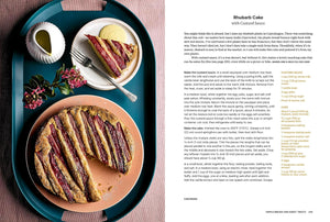 A two-page spread from a cookbook featuring a recipe for Rhubarb Cake with Custard Sauce. The left page shows a styled food photograph of sliced cake with custard sauce, a small bowl of jam, and a drizzle of oil on a teal plate, alongside the recipe text and ingredients on the right page. "Scandinavian Everyday".