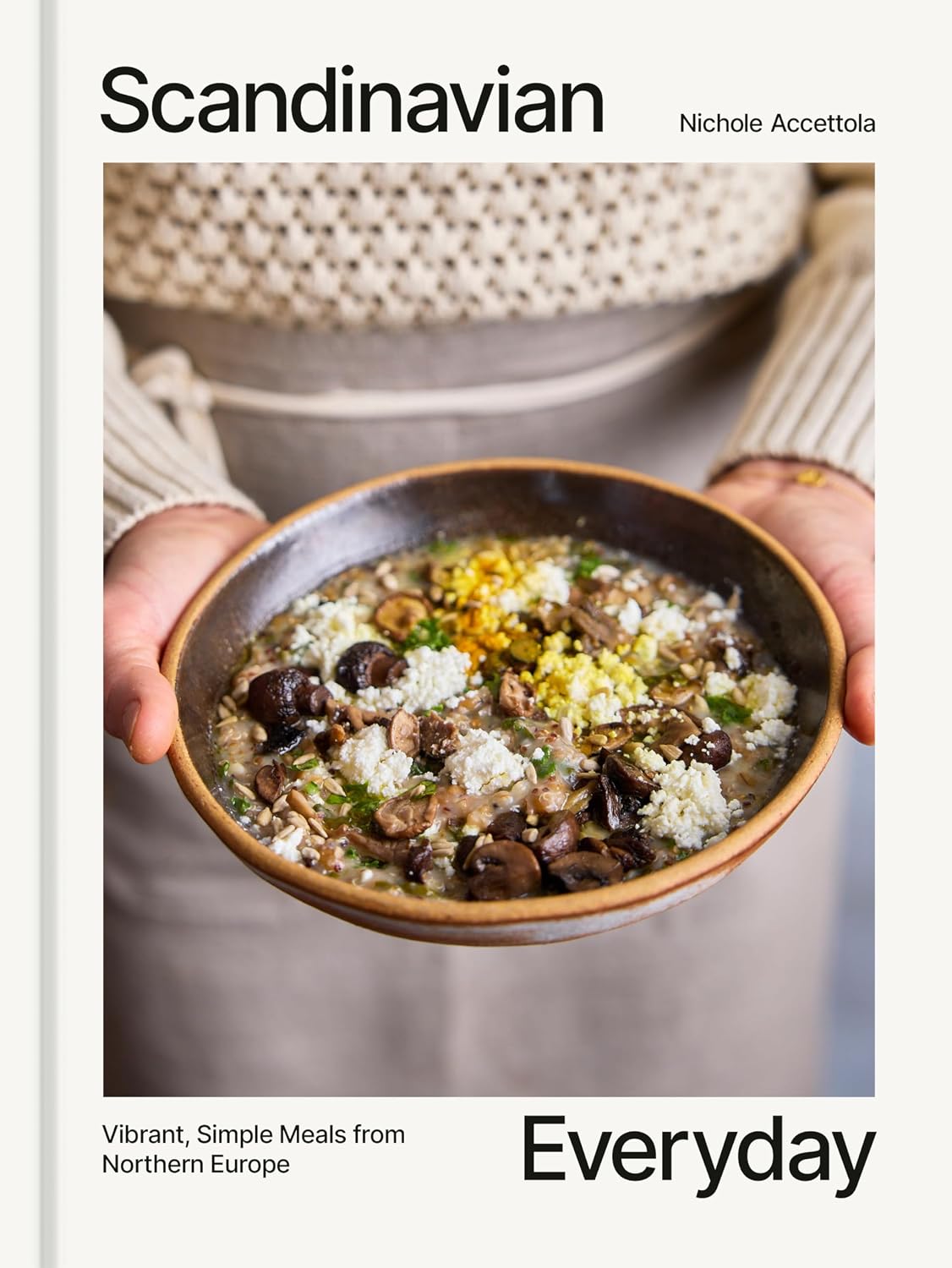 Book cover of 'Scandinavian Everyday' written by Nichole Accettola, with a bowl of prepared soup held by a person's hands. 