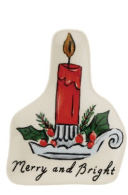 A ceramic Christmas ornament shaped like a candle holder, featuring a red candle, green holly leaves, red berries, and the text 'Merry and Bright' on a white background.