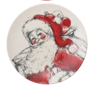 A round ceramic plate featuring a stylized sketch of Santa Claus in red and white with black sketch lines, holding a bag of christmas ornaments, shown on a plain white background.