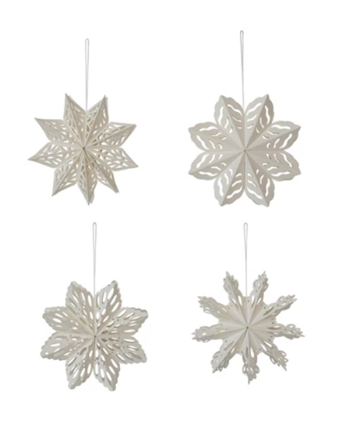 Set of four white paper snowflakes in coordinating designs. 