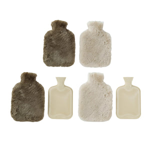 Hot water bottle with either dark grey or cream colored sheep fur cover. 