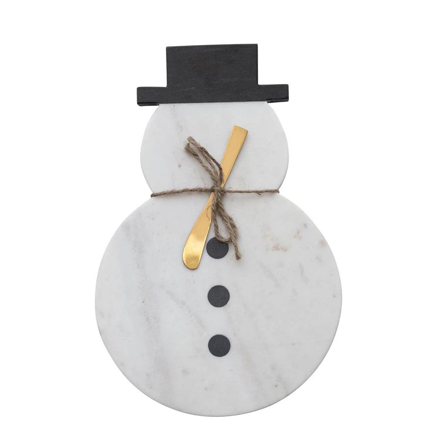 White marble snowman board with gold knife and black top hat. 