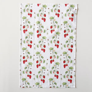 Cotton tea towel with watercolor strawberry pattern on a white background. Emily Lex Studios. 