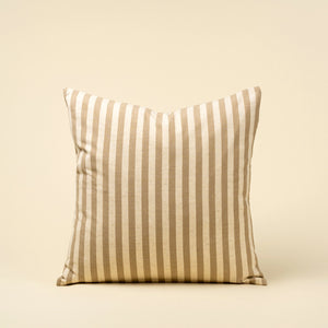 Striped linen pillow with beige and white stripes on a beige background