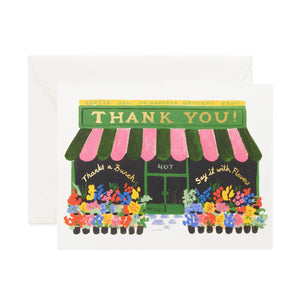 Greeting card with a store front flower shop design and 'Thank You!' text on a white background.