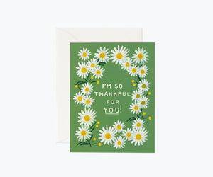 Greeting card with daisy design and text "I'm so thankful for you!" on a green background.
