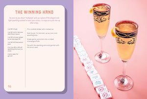 A split-page design or recipe card titled 'THE WINNING HAND' with cocktail recipes, shown beside two filled champagne flutes with black-and-gold patterns, a lemon wheel, and a row of playing cards on a pink background.