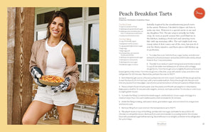 A two-page spread from a cookbook featuring a photo of a smiling woman holding a basket of peach breakfast tarts on the left page, and the recipe title 'Peach Breakfast Tarts' with ingredient and preparation text on the right page.