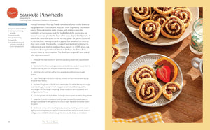 A printed recipe spread page for Sausage Pinwheels, with the left side containing text instructions and the right side showing a plated baked pinwheel on a white plate over a yellow-and-white checkered cloth.