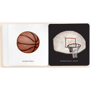 Children's book with illustrations of a basketball and a basketball hoop on white pages.