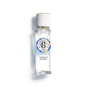 A clear glass perfume bottle with a white cap and a blue, yellow, and black circular label reading Roger & Gallet Vanille Soleil, shown on a white background with a soft shadow.