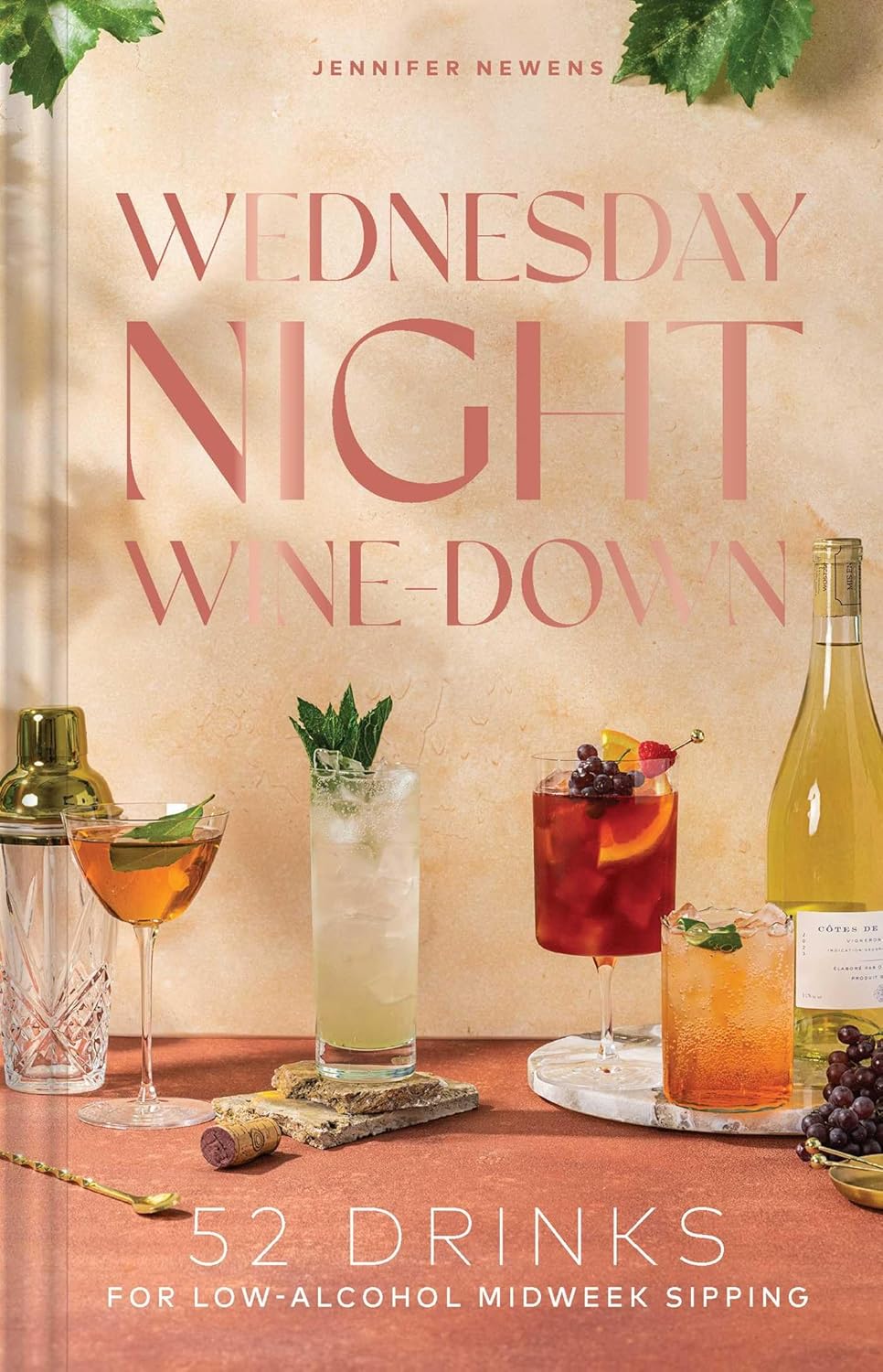 Front cover of wine cocktail book written by Jennifer Newens. Displayed are various prepared drinks from inside. 