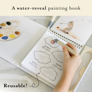 Water-reveal painting book with a hand holding a brush and water droplet, showing reusable text. Wishy Washy by Tabitha Paige. 