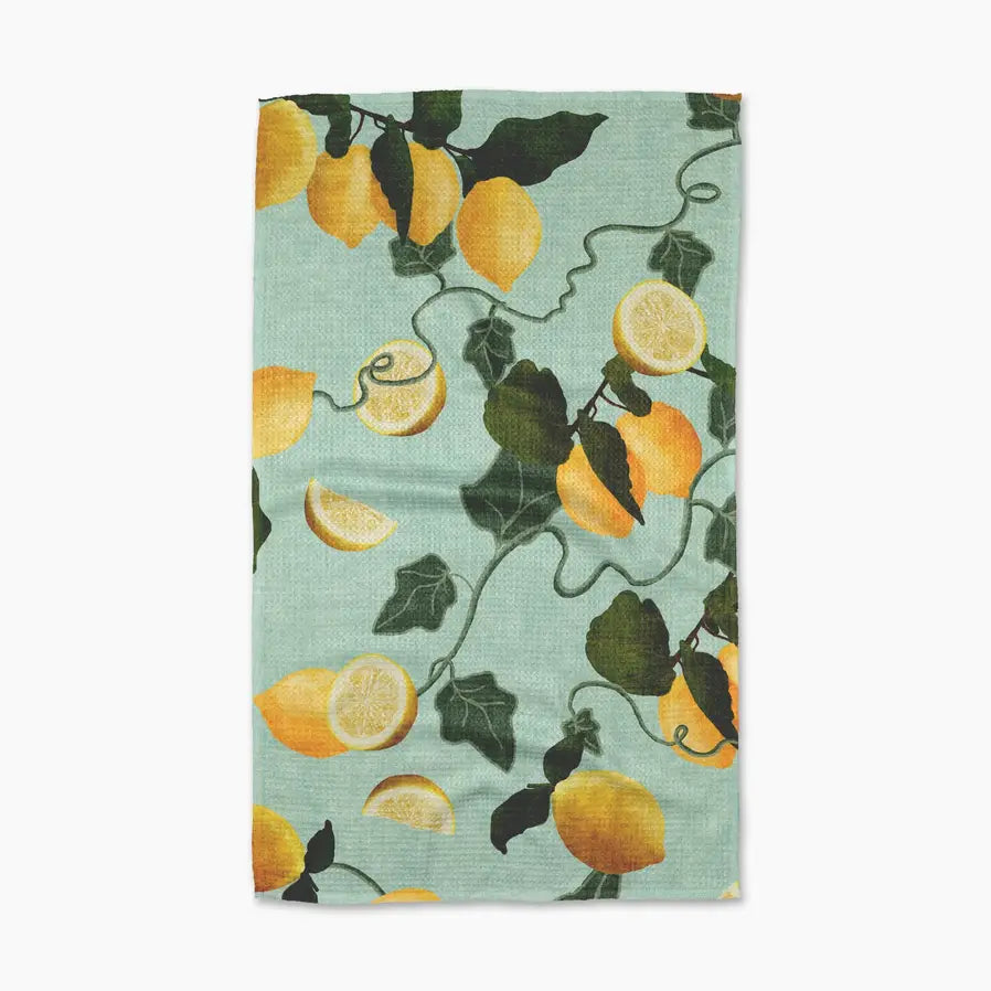 Towel with lemon and vine pattern on a light blue background