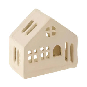 A small house-shaped metal candle holder in a warm cream or off-white color, shown on a plain white background.