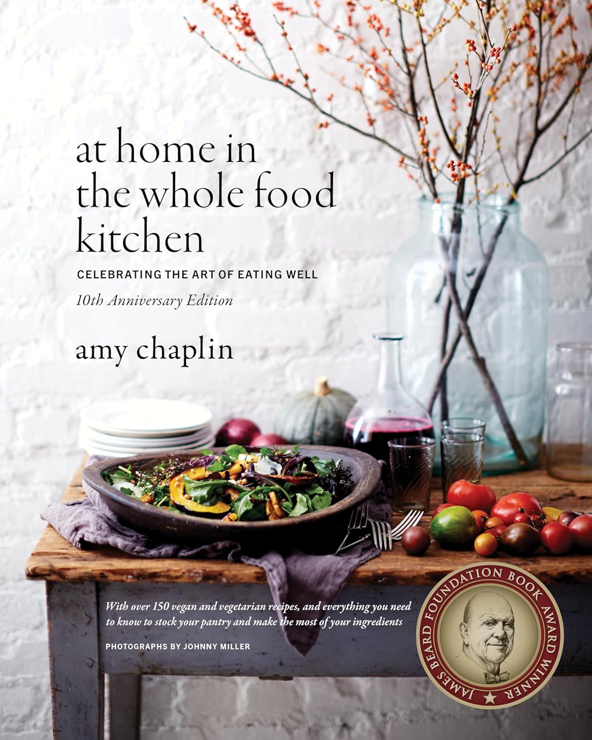 Front cover of 10th anniversary edition "At Home in the Whole Food Kitchen" written by Amy Chaplin. James Beard award winner.