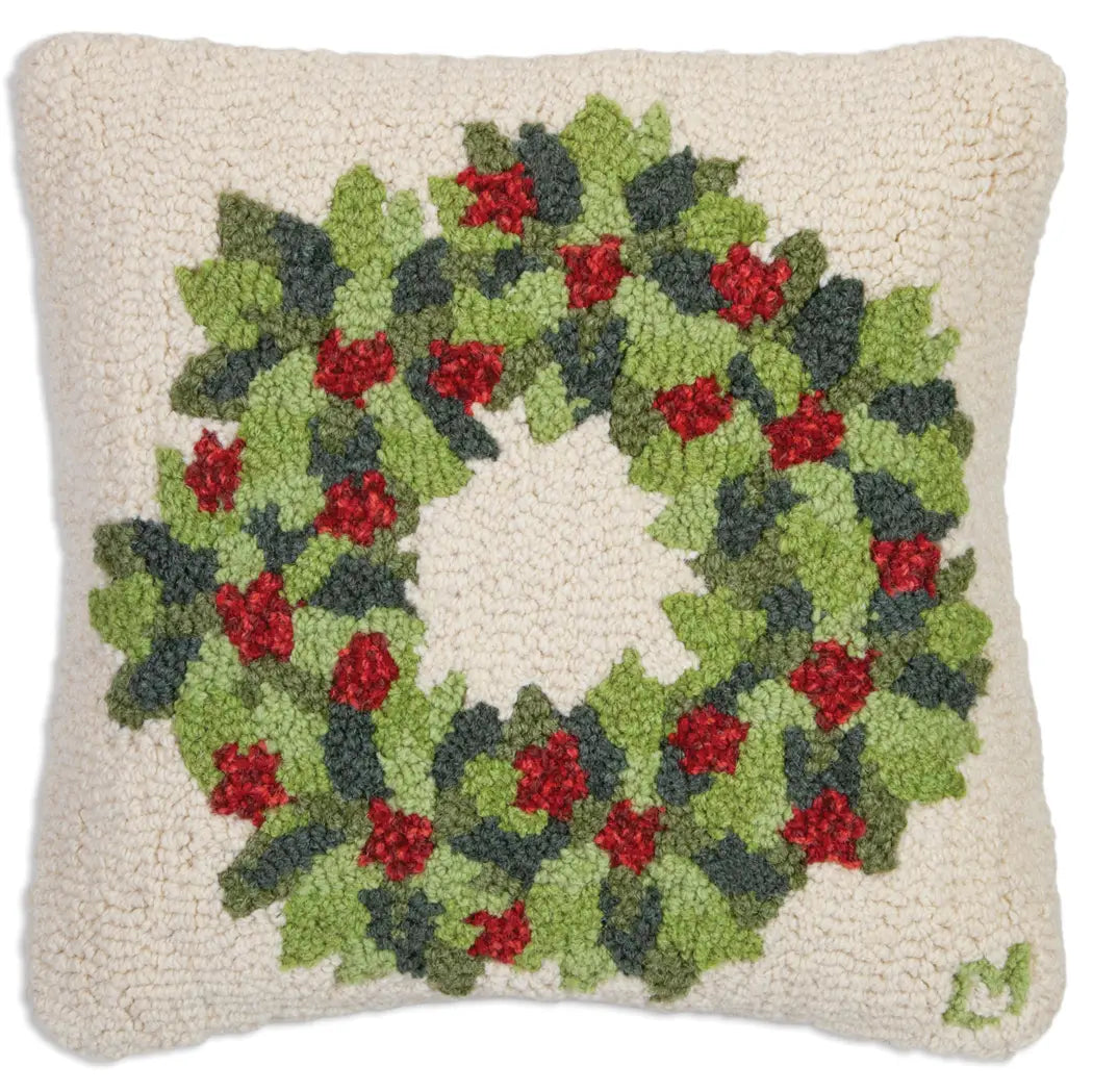 Wool holiday pillow with hooked berries and leaves on a holiday wreath. Chandler 4 Corner. 