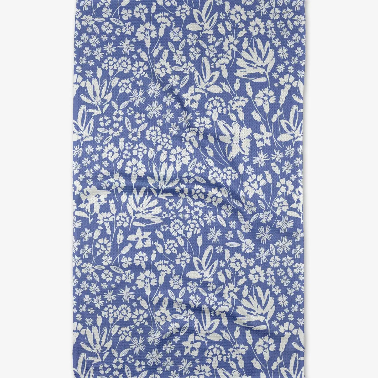 white Floral patterned on a blue tea towel
