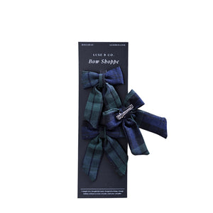 set of three mini fabric bows in festive blue and green plaid design. 