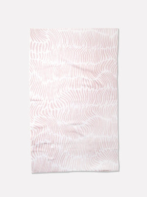 A rectangular light pink & white towel  featuring a light pink wavy, dotted abstract pattern, displayed flat against a light gray background. Geometry. 