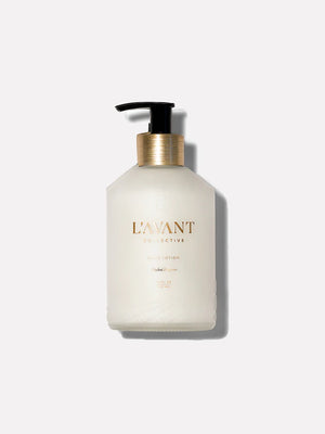 Blushed Bergamot Hand Lotion in a matte clear bottle with black plastic pump. L"AVANT Collective