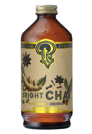 Bottle of Portland Syrup Co. Bright Chai syrup on a white background