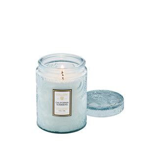 5.5 ounce blue etched glass jar candle in scent California Summers by Voluspa. 