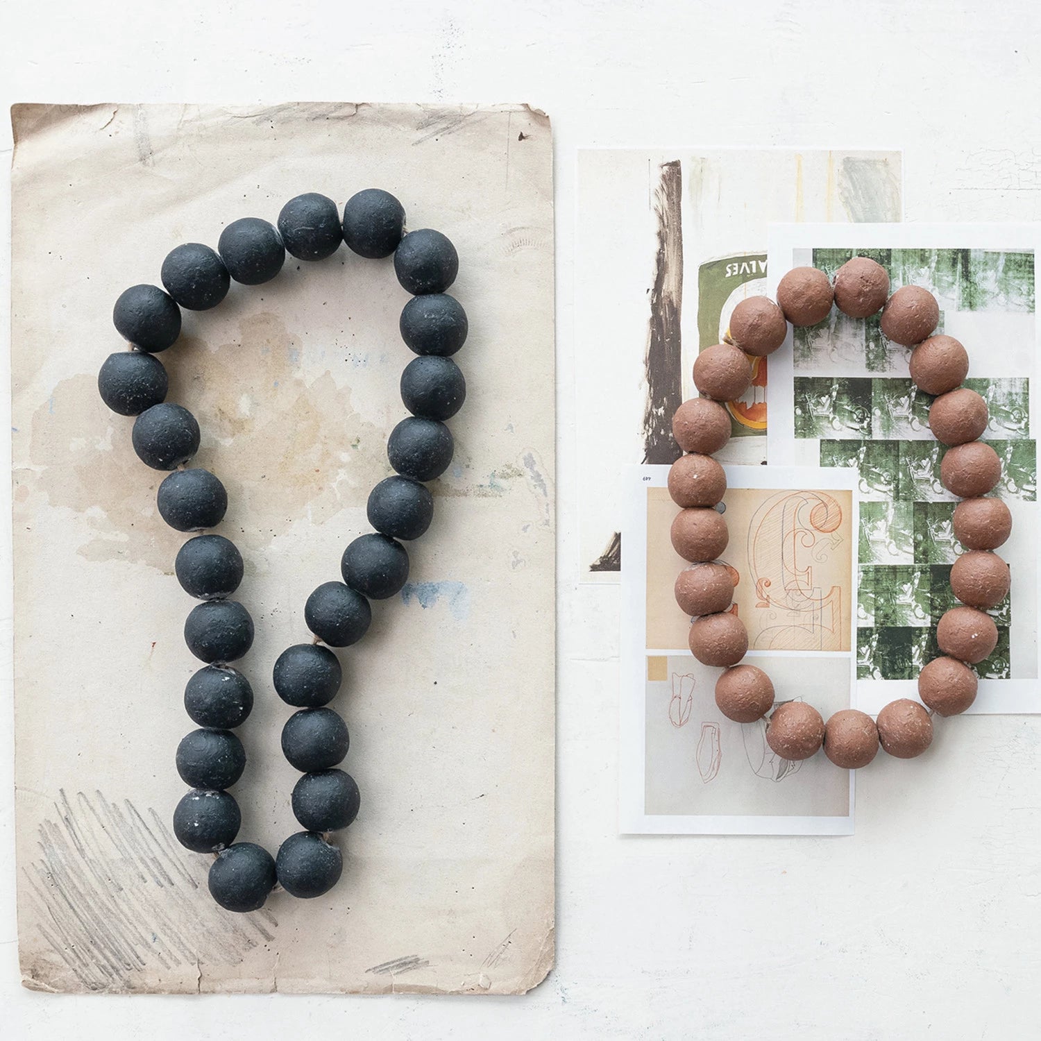 black and brown distressed cement beaded garlands.