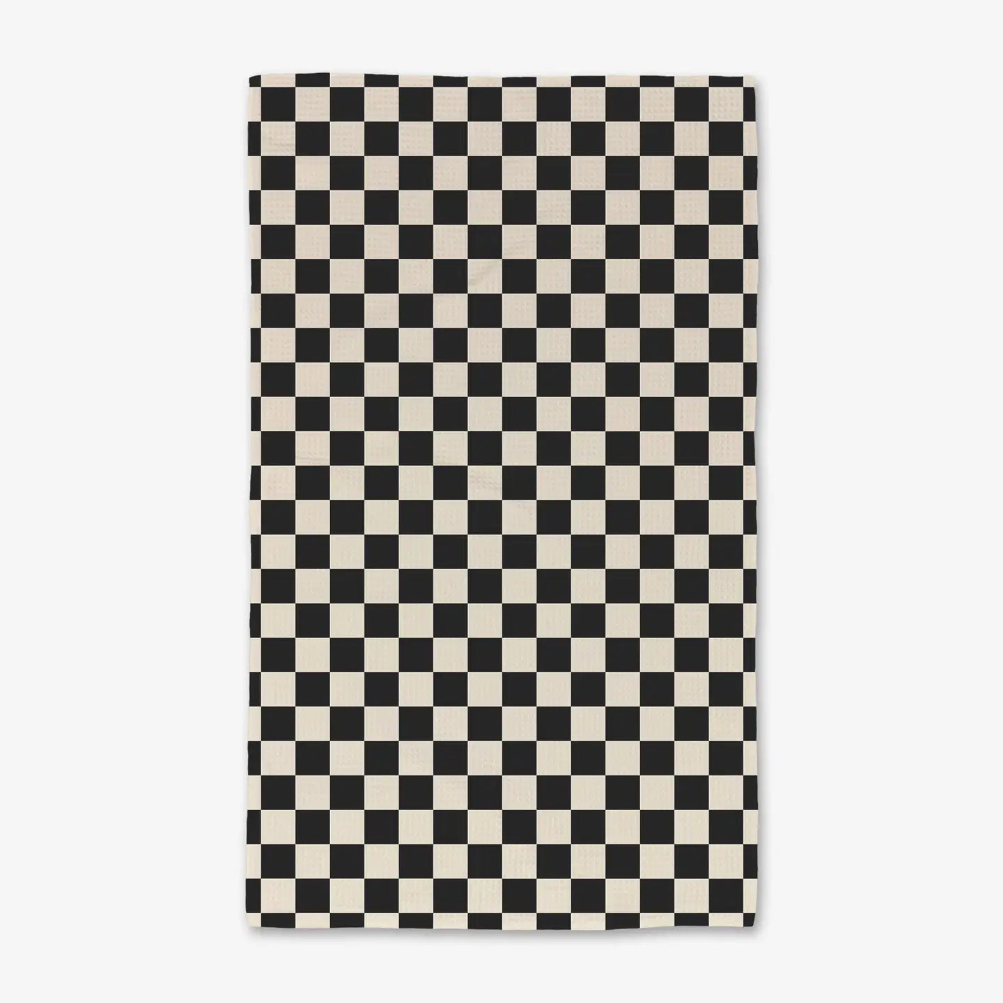 Checkered black and cream microfiber lux bath towel on a white background. Geometry House. 