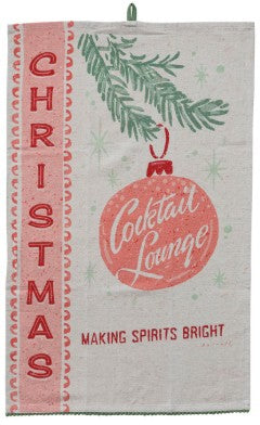 A vintage-style Christmas cocktail towel with a beige linen background, featuring a pink vertical 'CHRISTMAS' banner, green pine branches, a pink ornament reading 'Cocktail Lounge,' and the phrase 'Making Spirits Bright.'.