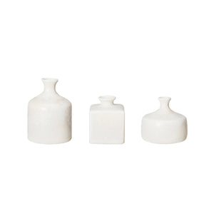 Three cream stoneware vases of different shapes and sizes on a white background.