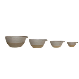 Coordinating series of white and natural ceramic batter bowls side by side. 