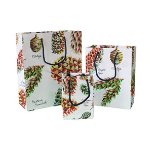 Pinecones on a white background gift bags of three sizes