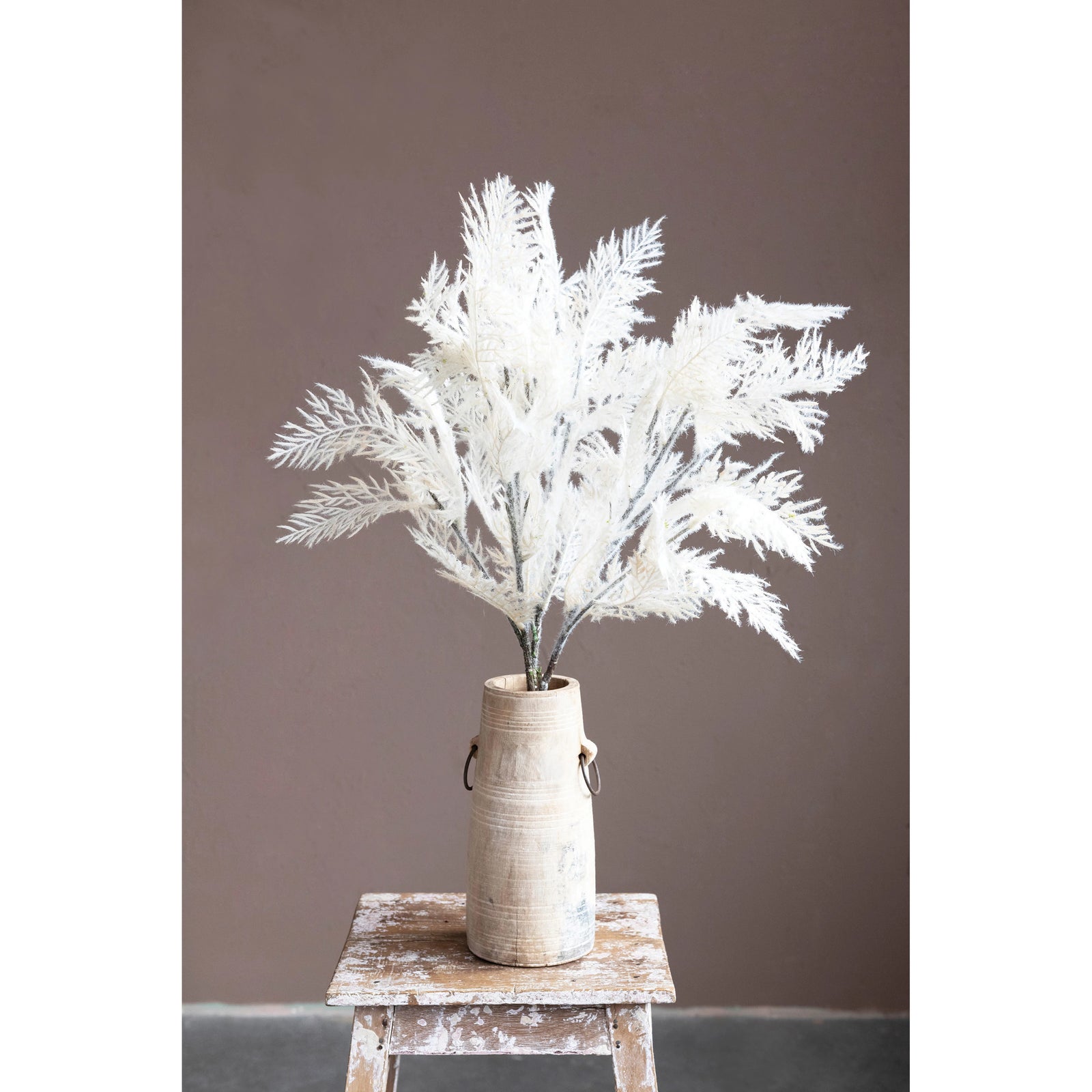 Faux flocked reed plume stem in cream color. Holiday faux florals in artisan vase on rustic farmhouse table. 