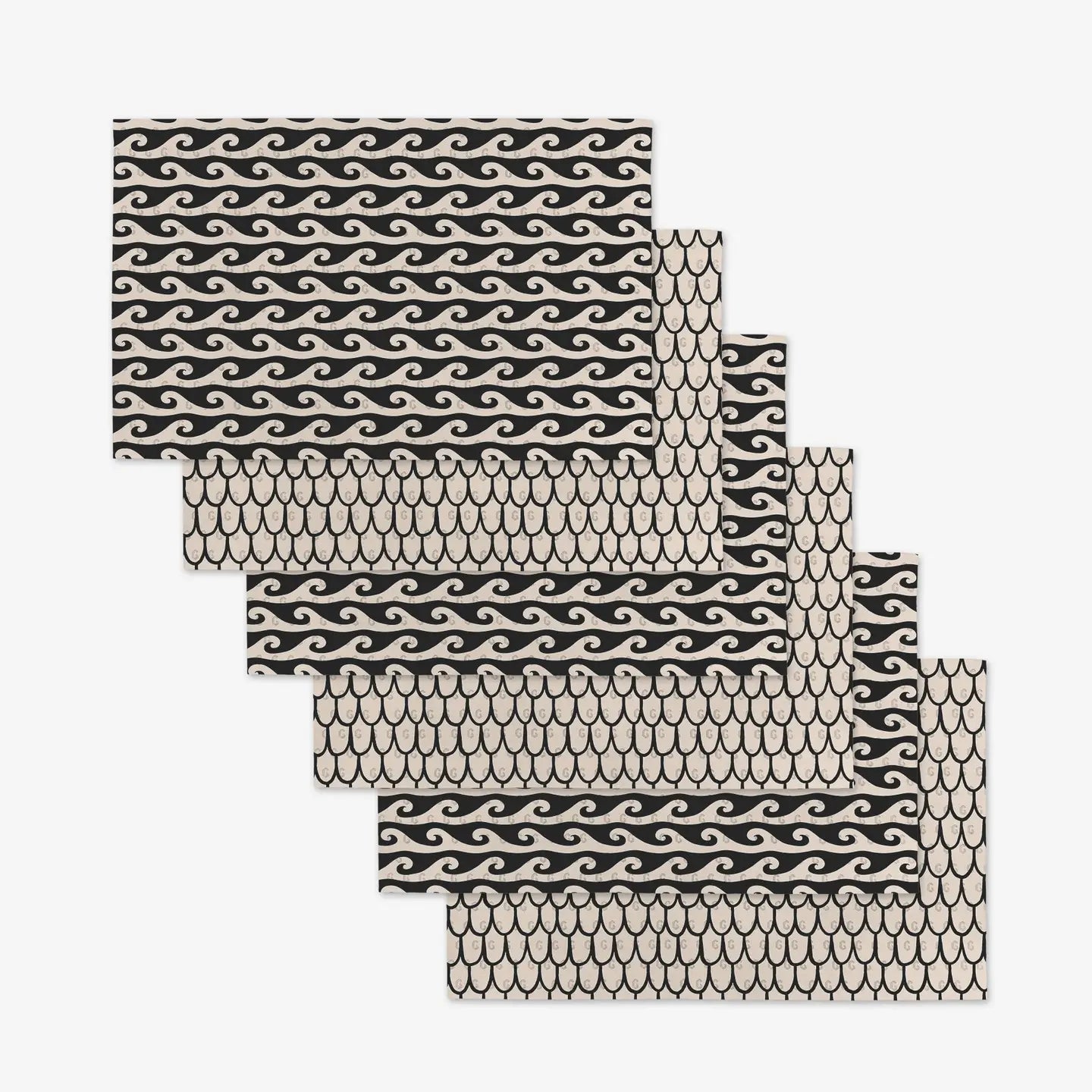 Set of black and white wave and fish scale patterned not paper towels on a white background