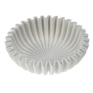 White ceramic bowl with textured design on a white background