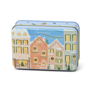 Decorative tin with a festive Christmas village design on a white background. Gingerbread Vanilla. 