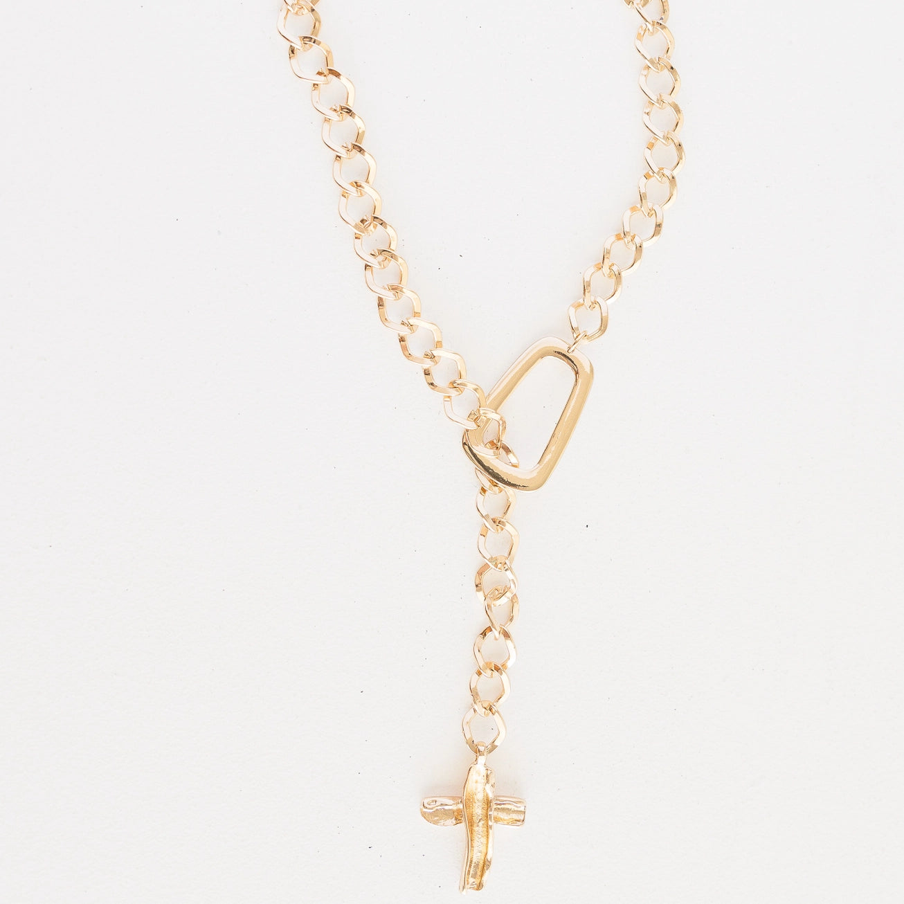 Gold chain link cross pendant necklace. 