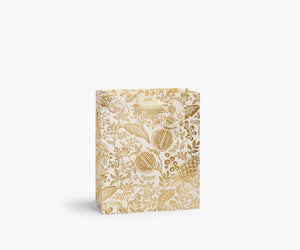 Medium gold floral-fruit patterned gift bag on a white background. 