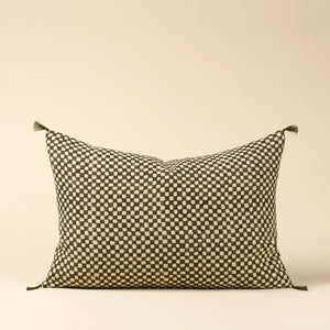 Decorative lumbar pillow with a checkered green pattern on a beige background
