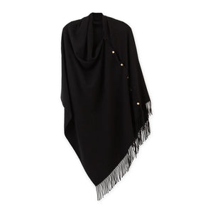 Black poncho with gold snaps and fringe.