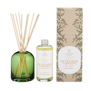 Linnea Heirloom Tomato diffuser set with green bottle, white bottle, and patterned box on a white background