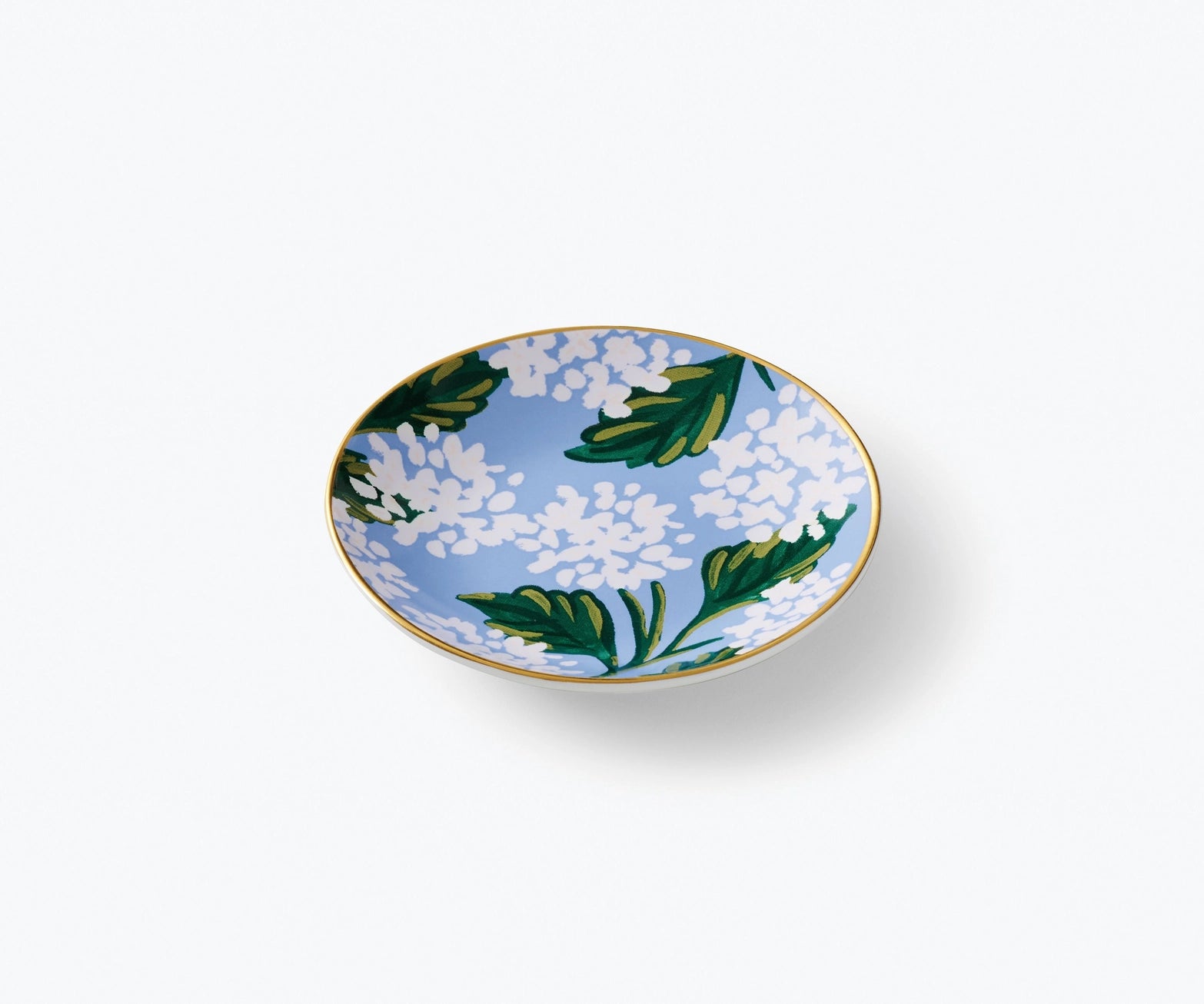 Decorative ring dish with blue floral hydrangea pattern on a white background. Rifle Paper Co. 