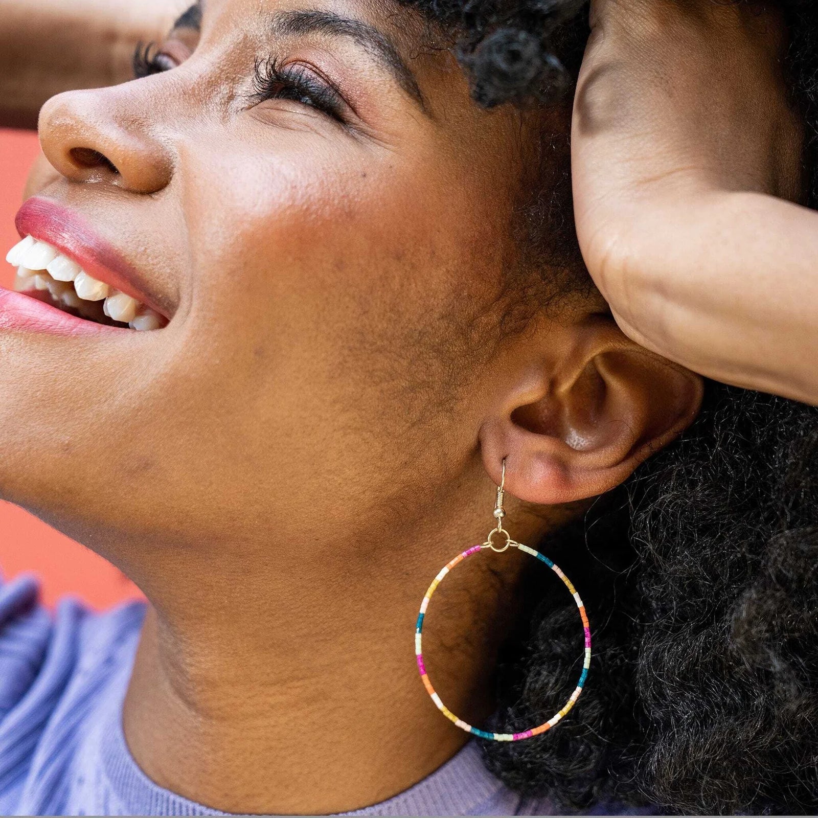 Multicolored glass beaded hoop earring. Ink & Alloy. 