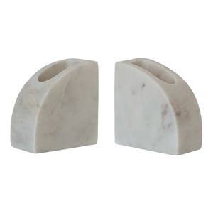 Two marble bookends on a white background