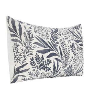 Linen lumbar pillow with denim blue floral pattern in a watercolor style.